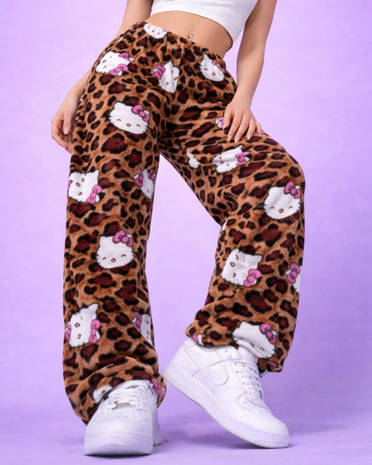 Front view of Hello Kitty leopard print pyjama bottoms with elastic waistband and all over character print, women’s soft fleece lounge pants studio image