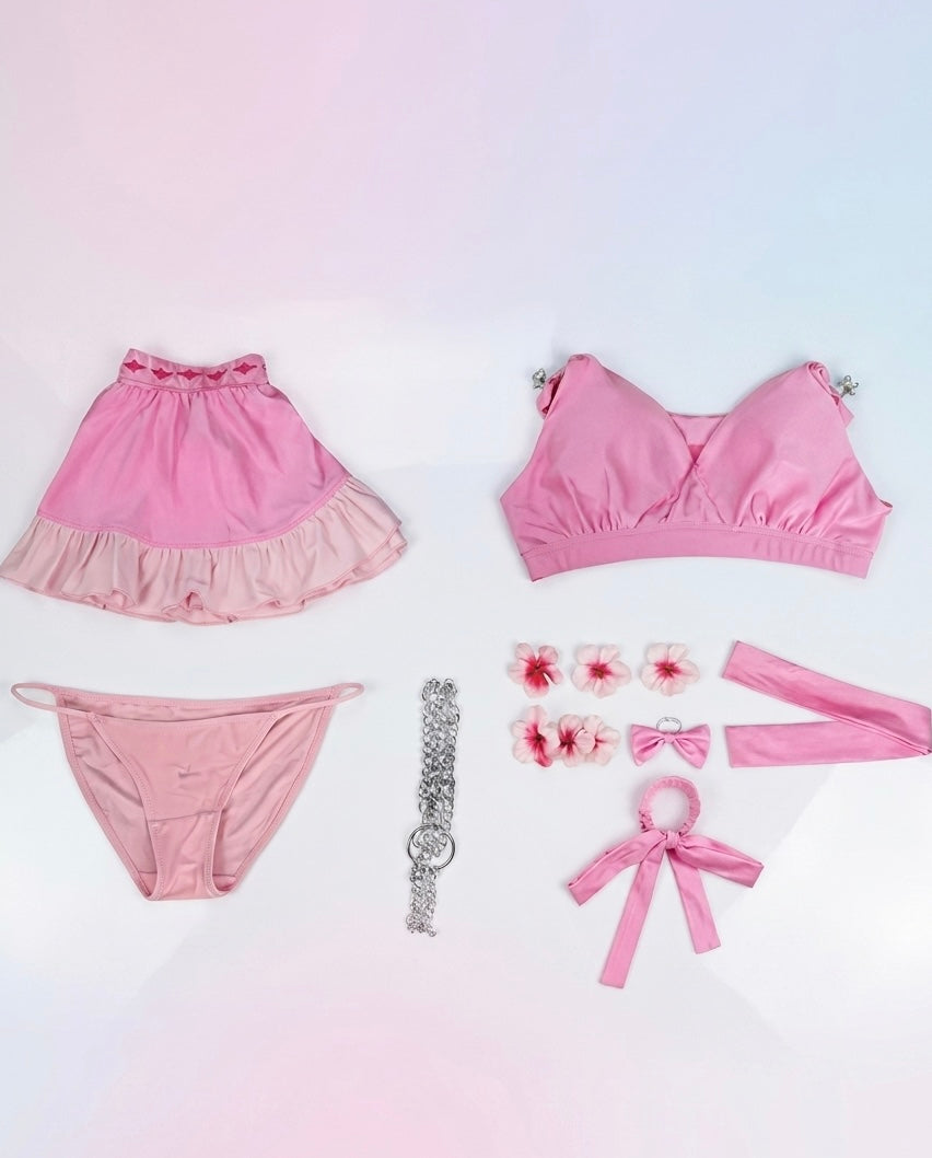 Pink women's lingerie set with accessories on a gradient background