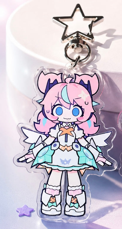 Anime character keychain with pink hair and star accessories on a light background