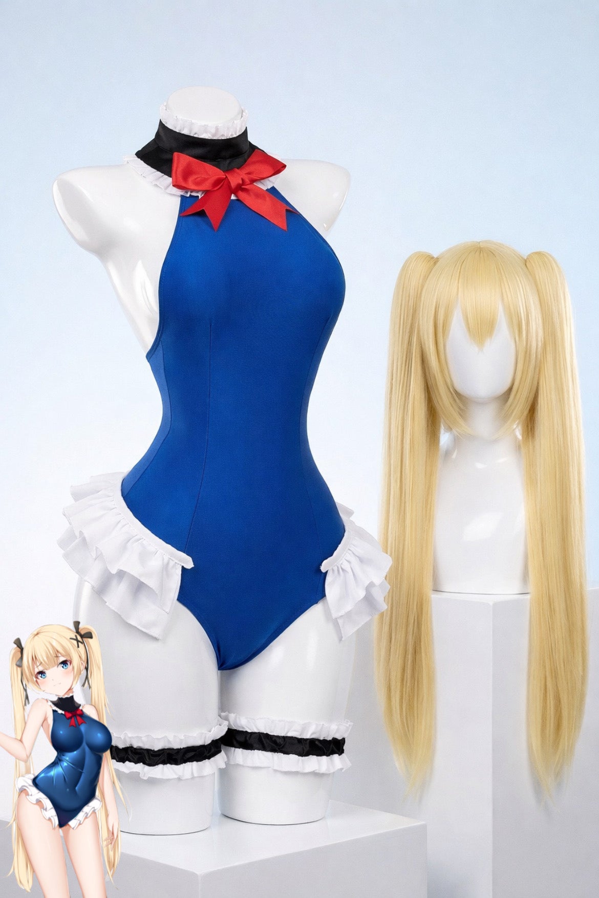 Mannequin wearing a blue dress with a red bow and white ruffles, accompanied by a blonde wig and a small figure of a character in a similar outfit.