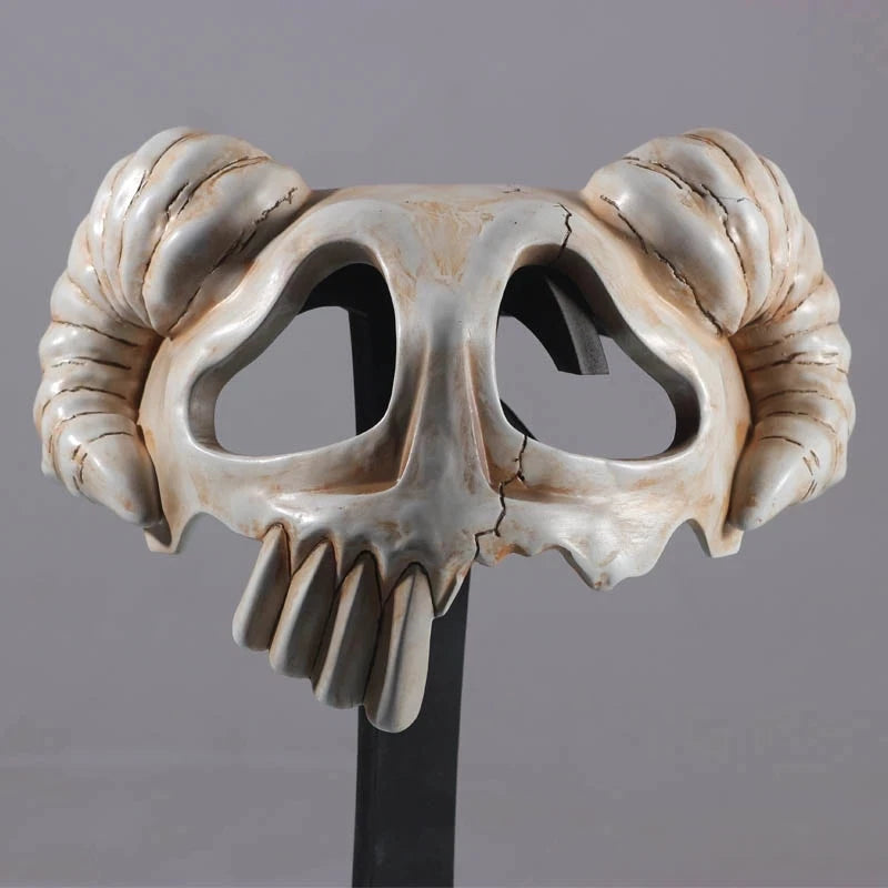 Decorative skull with ram's horns on a gray background