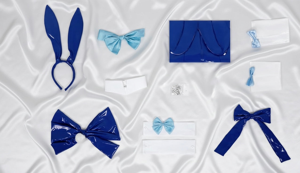 Collection of blue accessories including headbands and hair clips on a white fabric background
