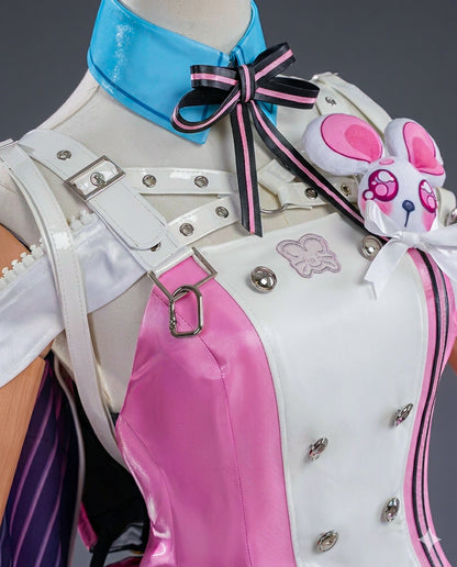 Close-up of a character costume with pink and white design, blue bow, and decorative elements.