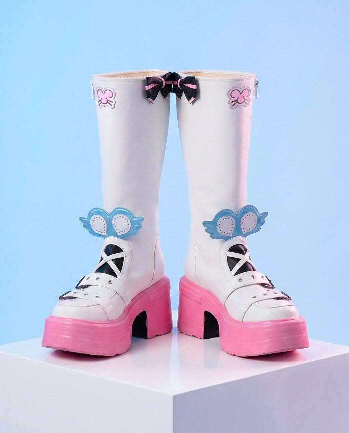 White platform boots with pink soles and decorative elements on a light blue background