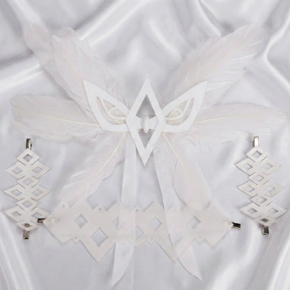 White geometric earrings on a white fabric background