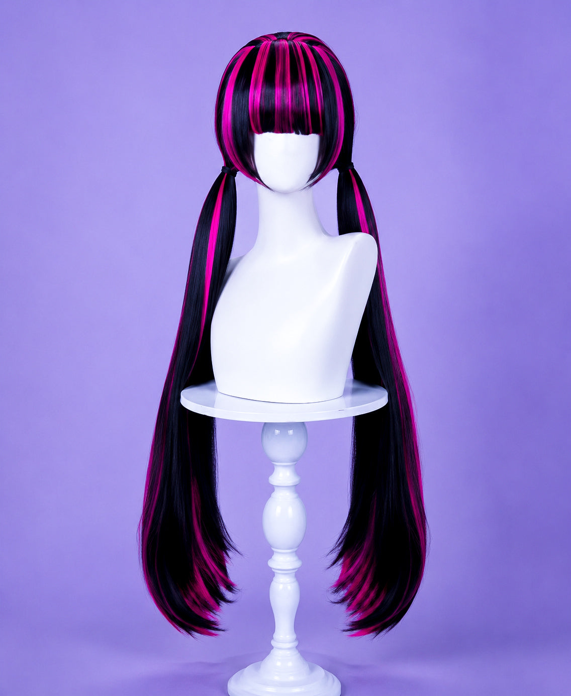 Draculaura cosplay wig front view with black and pink twin tails displayed on a white mannequin head in a professional studio.