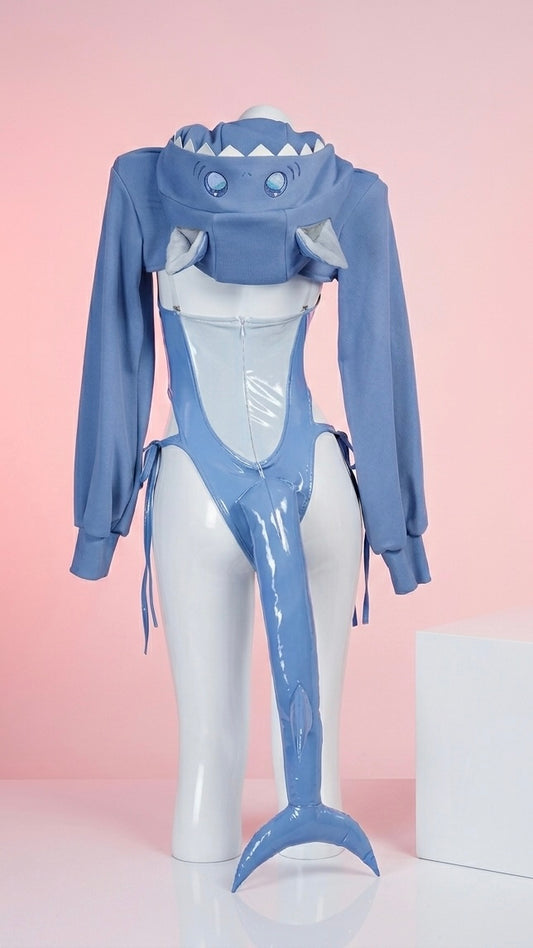 Rear view of the Gawr Gura swimsuit cosplay showing the low-back design and a 100cm poseable plush shark tail with a gradient blue-to-teal finish.