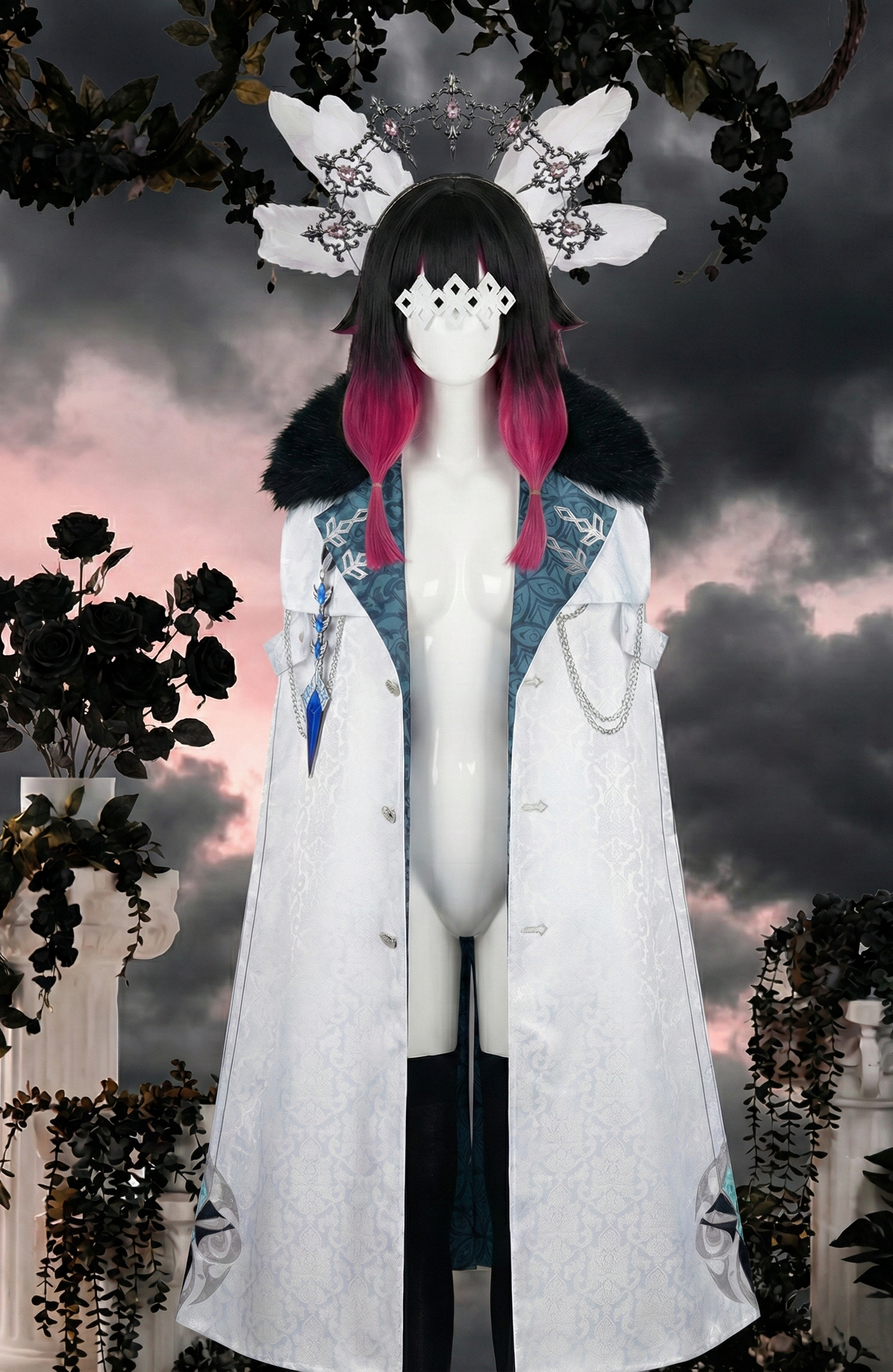 Mannequin displaying a Genshin Impact Columbina cosplay by MBCosplay, featuring a detailed white Fatui Harbinger cloak with a black fur collar, paired with a black and pink ombre wig, white feathers, eye mask, and a silver gemstone headband
