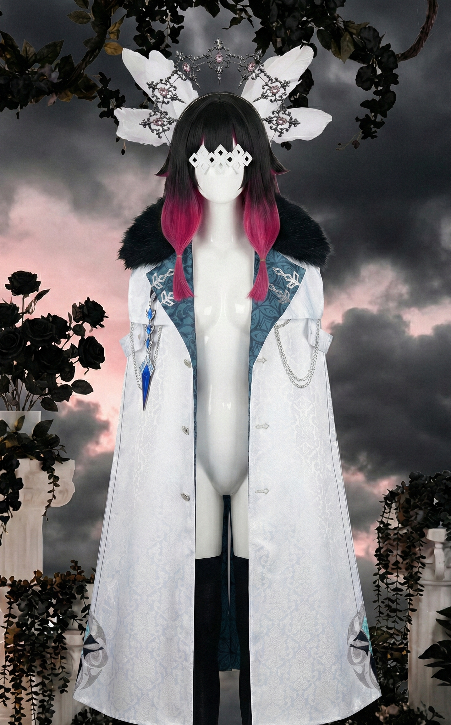 Mannequin displaying a Genshin Impact Columbina cosplay by MBCosplay, featuring a detailed white Fatui Harbinger cloak with a black fur collar, paired with a black and pink ombre wig, white feathers, eye mask, and a silver gemstone headband.
