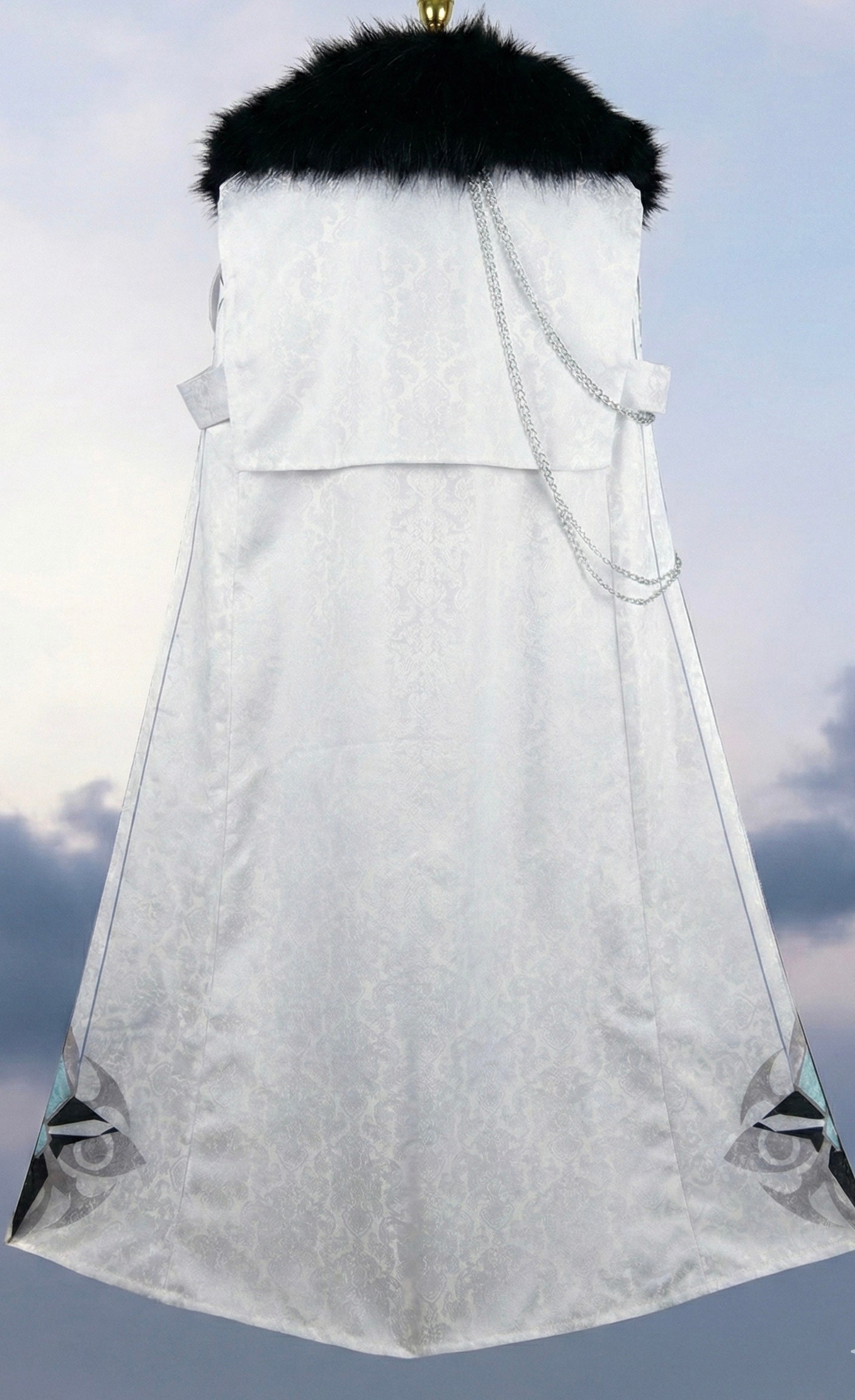White fur-trimmed coat with a hood against a cloudy sky