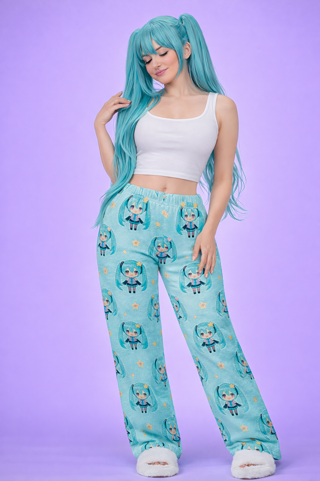 Person wearing teal pajama pants with character print on a purple background