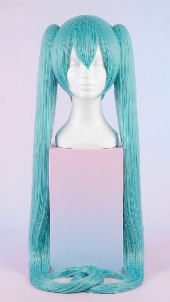 Display of the extra-long, vibrant teal Hatsune Miku cosplay wig featuring straight bangs and twin tails on a mannequin head