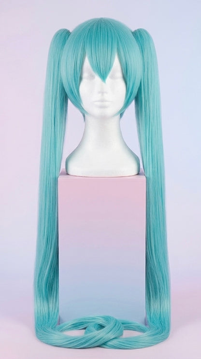 Display of the extra-long, vibrant teal Hatsune Miku cosplay wig featuring straight bangs and twin tails on a mannequin head