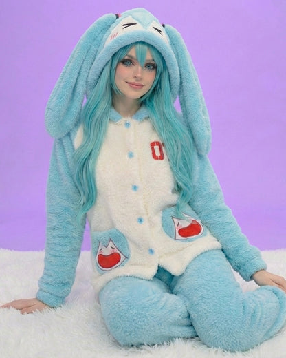 Person wearing a blue and white bunny costume with long ears against a purple background