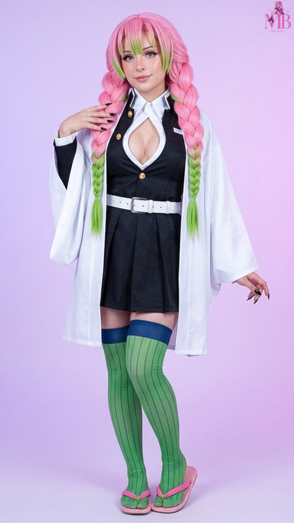 Front pose of the Kanroji Mitsuri Demon Slayer cosplay costume with optional pink and green braided wig, authentic Love Hashira uniform, white haori, pleated skirt, belt and matching accessories.