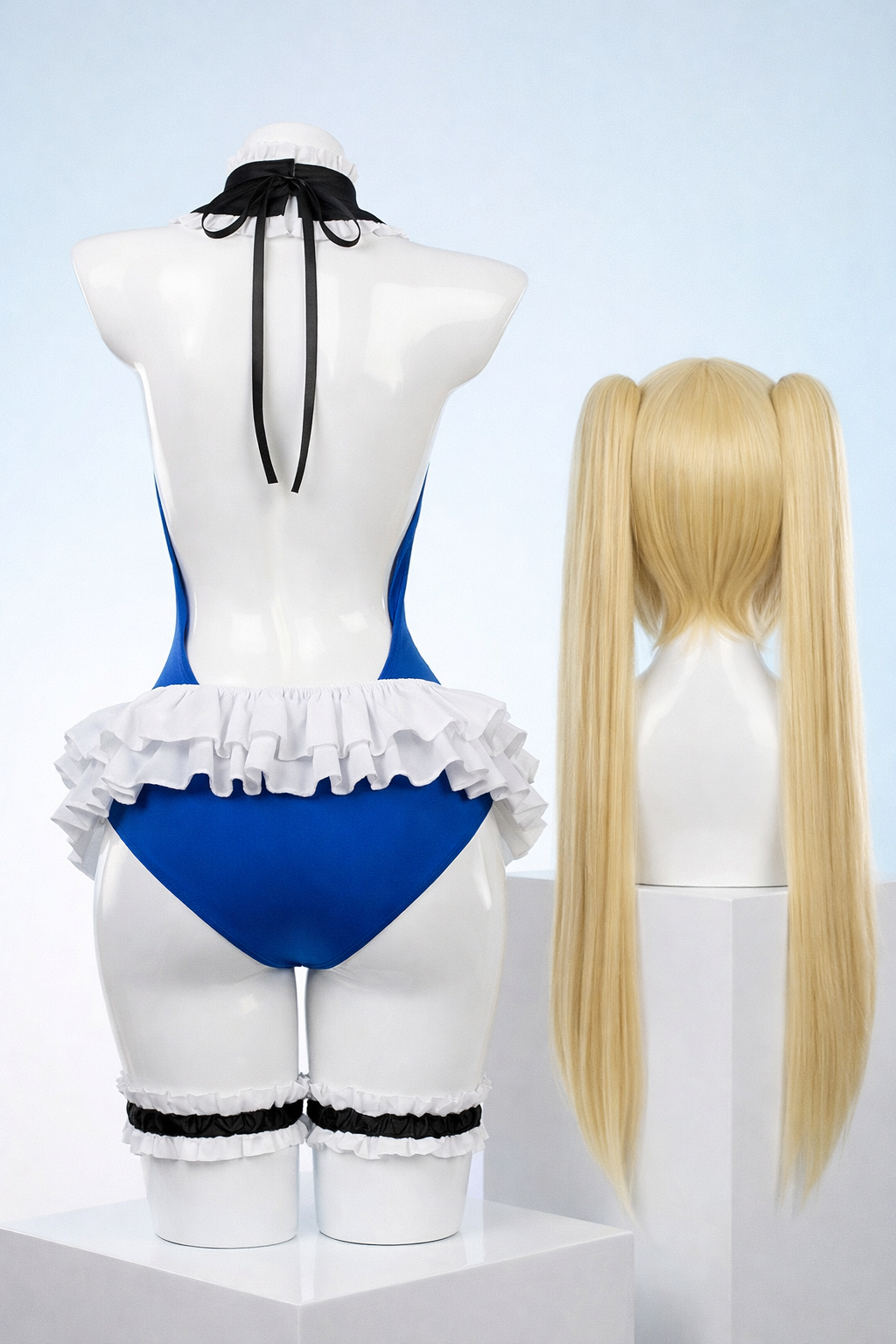 Blue lingerie set with ruffled details on a mannequin, accompanied by a blonde wig on a separate stand.