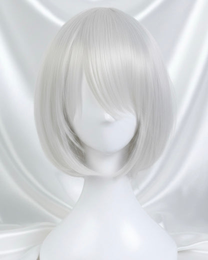 A close-up of a high-quality white synthetic cosplay wig styled in a short, sleek bob with side-swept bangs, designed for the character 2B from Nier Automata.