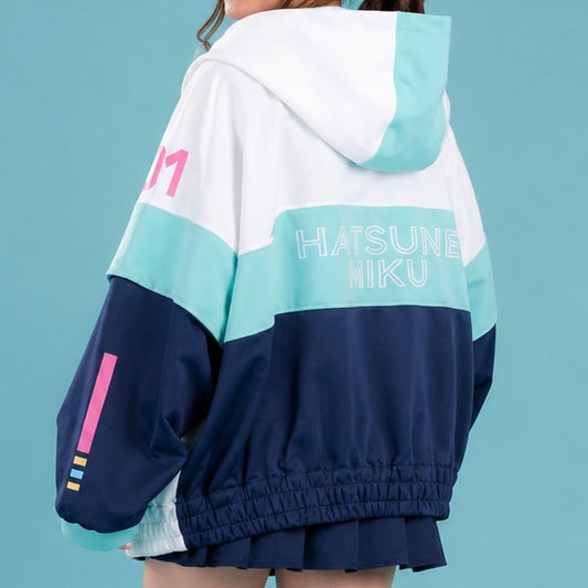Back view of MBCosplay Hatsune Miku cosplay windbreaker jacket featuring embroidered Hatsune Miku text, oversized hood and anime-inspired Vocaloid streetwear styling.