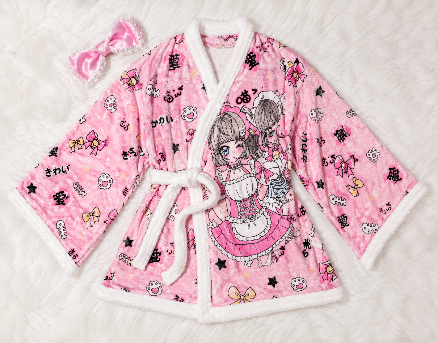 MBCosplay kawaii pink anime fleece robe featuring cute bow details, Japanese-inspired artwork, plush white trim, and soft cosy fabric displayed as a flat lay loungewear product image.