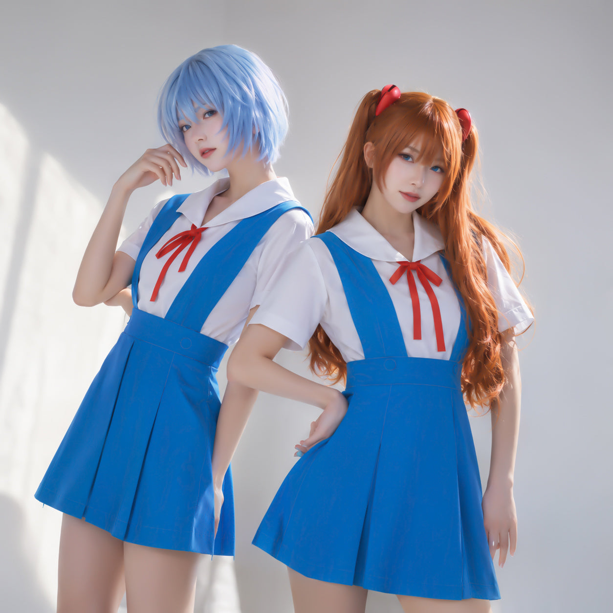 Professional cosplay photoshoot featuring Rei Ayanami and Asuka Langley Soryu wearing their iconic Neon Genesis Evangelion school uniforms.