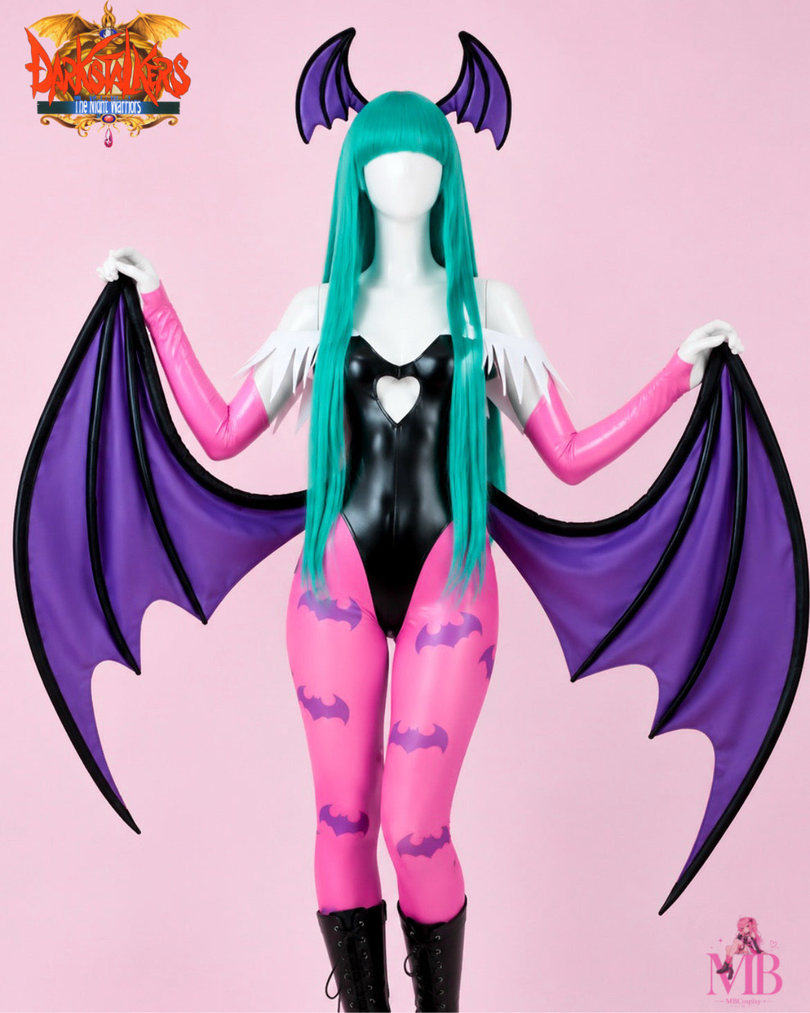Front view of Morrigan Aensland Darkstalkers cosplay costume with purple bat wings, pink tights and teal wig