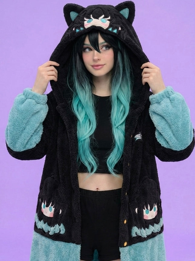 Person wearing a black hoodie with cat ears and paw designs on a purple background