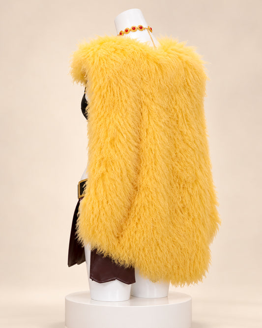 Back view of Nami’s Elbaph cosplay costume from One Piece, showing the long fluffy golden-yellow shawl, textured synthetic fur and brown costume panels.