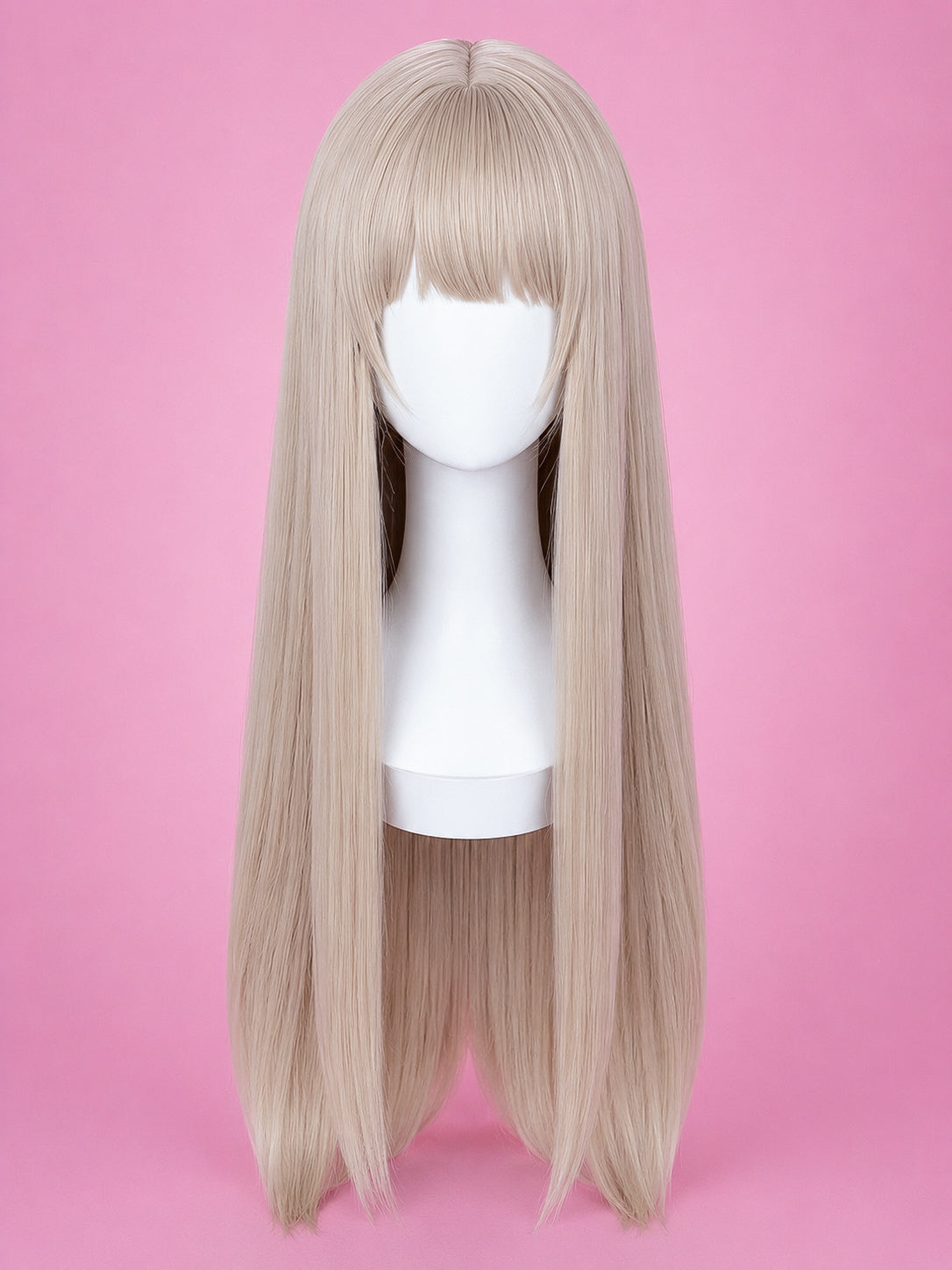 A long straight wig with bangs in a light ash blonde color, displayed on a white mannequin head against a solid pink background.