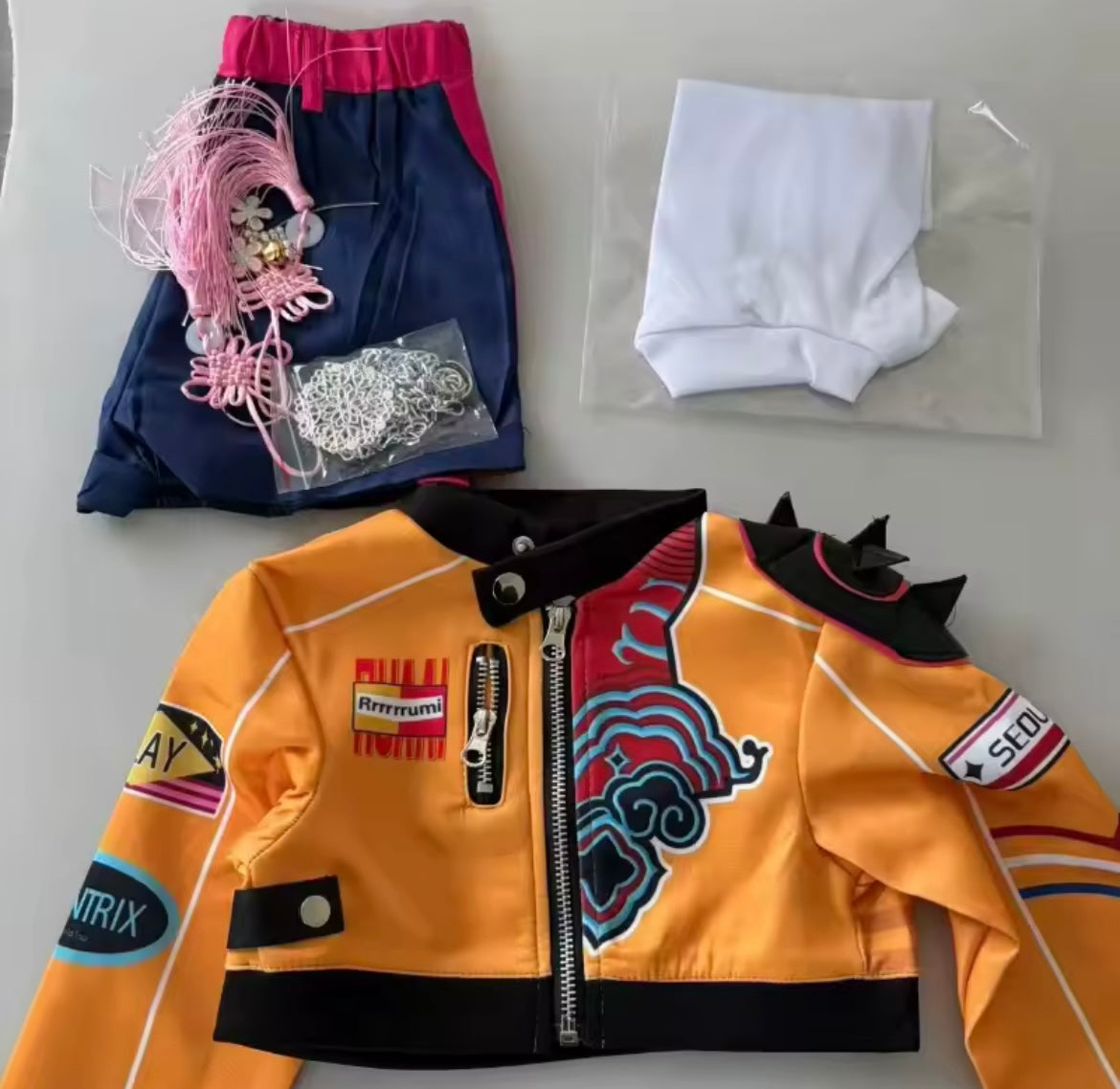 Rumi KPop Demon Hunters cosplay costume set with orange jacket, shorts, white top and accessories