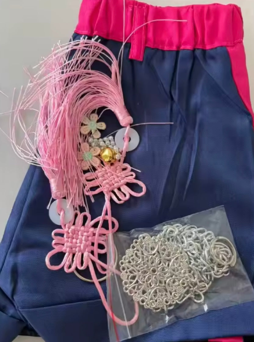 Rumi KPop Demon Hunters cosplay shorts with pink tassel accessories and silver chain