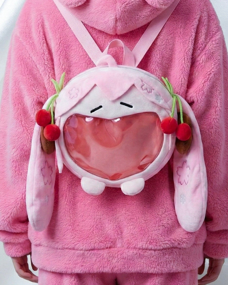 Model wearing sakura miku plush backpack for Sakura Miku Plush Bag - Kawaii Pink Cherry Blossom Backpack
