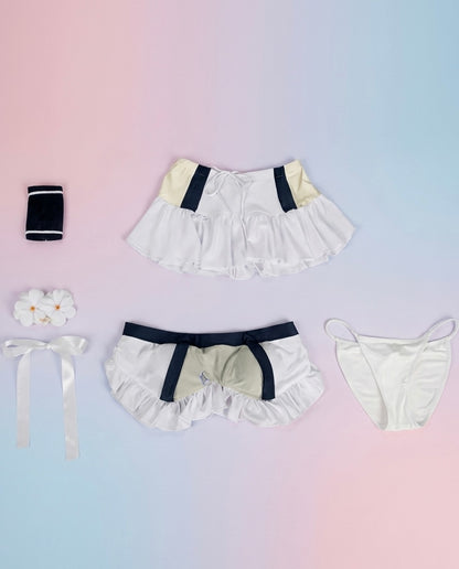 Set of ruffled underwear with decorative elements on a gradient background