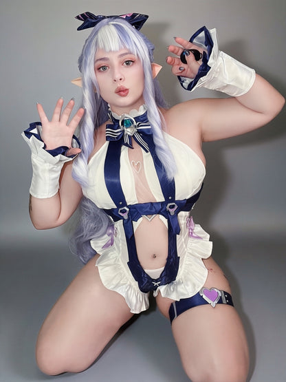Shiq Sama modelling the Vivian cosplay costume from Zenless Zone Zero in a seated pose, showing the full costume detailing