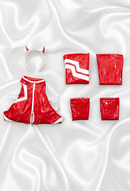 Red raincoat and matching pouches on a white fabric background