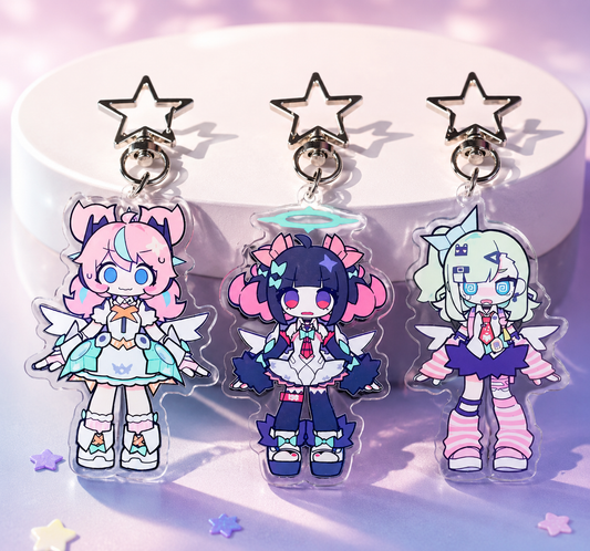 Three colorful character charms on a stand with a star design.