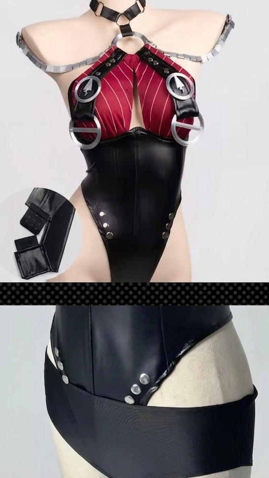 Black and red leather outfit with metallic accents on a mannequin against a gray background.