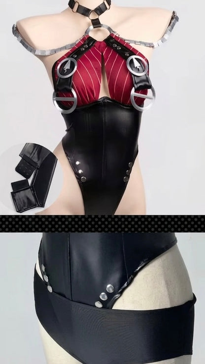 Black and red leather outfit with metallic accents on a mannequin against a gray background.